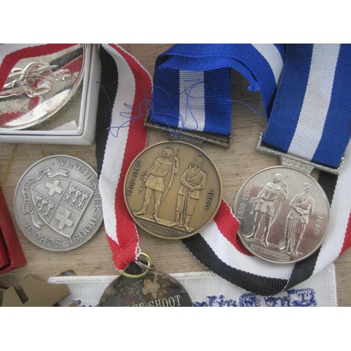 43 - A quantity of shooting prize medallions, medals and badges