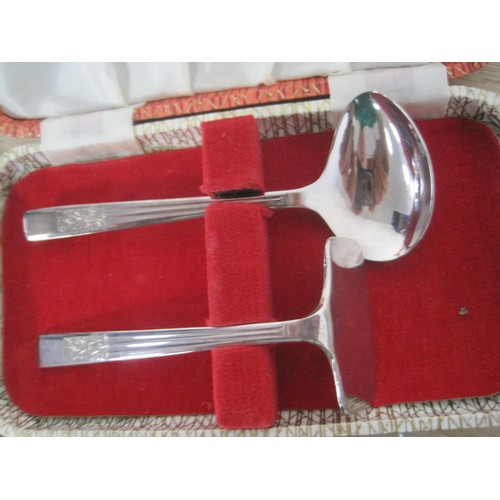 53 - A silver rectangle photo frame along with a silver plate pair of sugar tongs, a silver jubilee penkn... 