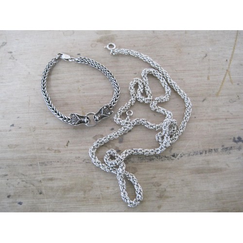 67 - A silver 925 silver rope neck chain 70cm and a similar double headed dragon bracelet total weight 90... 