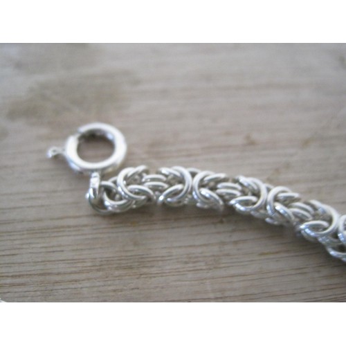 67 - A silver 925 silver rope neck chain 70cm and a similar double headed dragon bracelet total weight 90... 