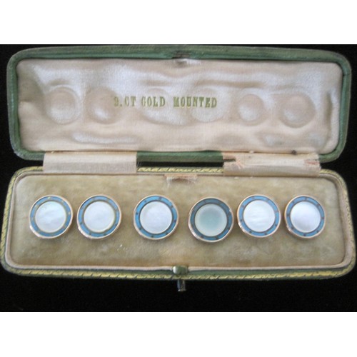 74 - Six 9ct gold mounted mop and enamel buttons in fitted box