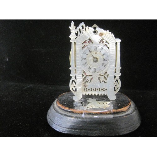 84 - A fretwork mother of pearl miniature clock with chain fusee watch movement