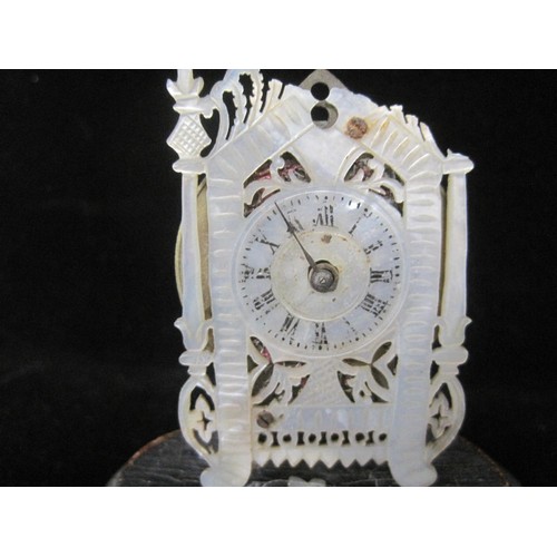 84 - A fretwork mother of pearl miniature clock with chain fusee watch movement