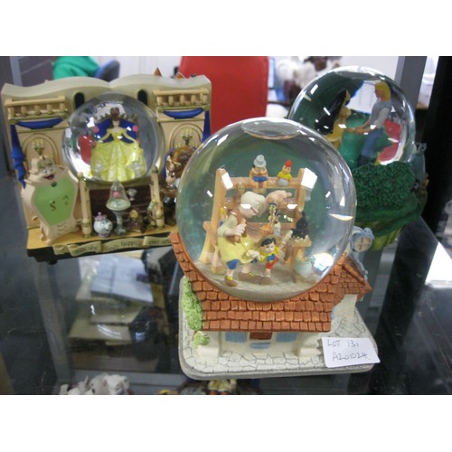 131 - Three Disney musical snowglobes - Pocahontas 'Colors of the Wind' (rotating), Pinocchio 'When you wi... 