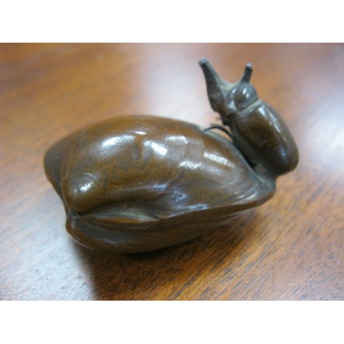 132 - A Japanese Rhino Beetle mounted on a whelk shell almost certainly in Bronze.
No maker or foundry mar... 