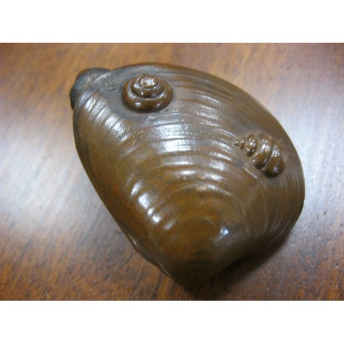 132 - A Japanese Rhino Beetle mounted on a whelk shell almost certainly in Bronze.
No maker or foundry mar... 