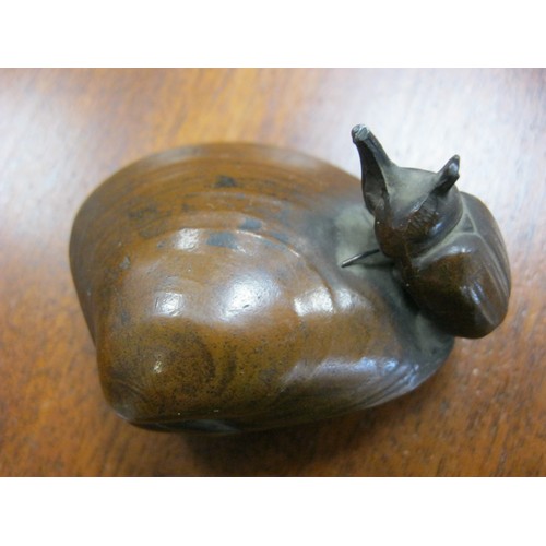 132 - A Japanese Rhino Beetle mounted on a whelk shell almost certainly in Bronze.
No maker or foundry mar... 