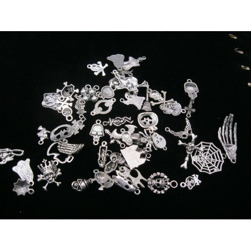 129 - A good selection of silver coloured charm bracelet charms to include lots of Halloween and some Chri... 