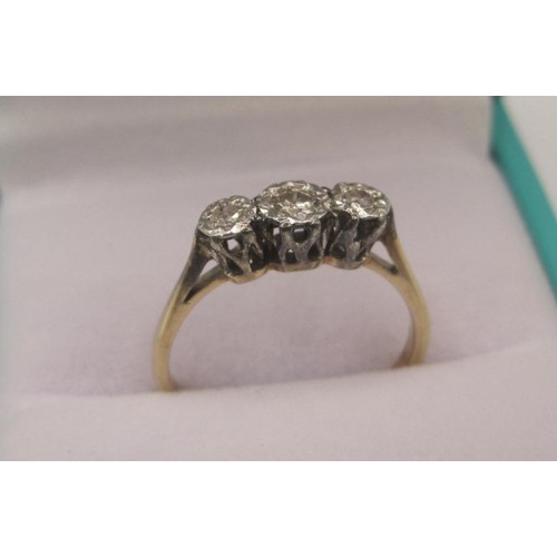 174 - A 9 carat gold diamond ring, three stones in illusion setting, ring size K, gross weight of ring app... 