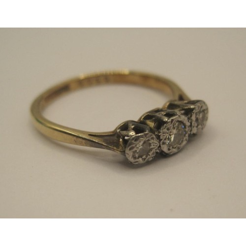 174 - A 9 carat gold diamond ring, three stones in illusion setting, ring size K, gross weight of ring app... 