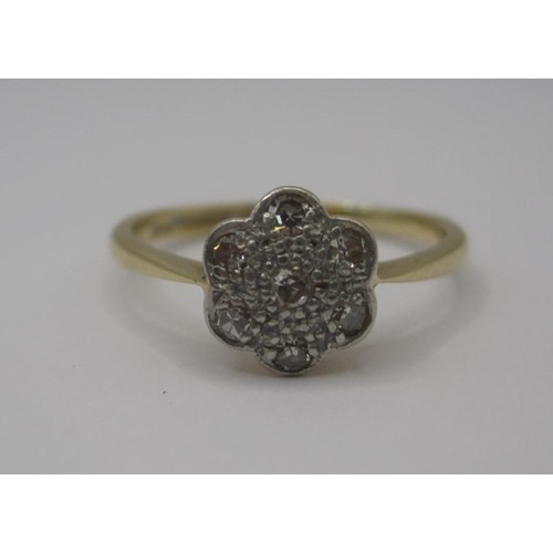 177 - 18 carat gold diamond ring, set with seven round cut diamonds in a foliate setting, ring size N, gro... 