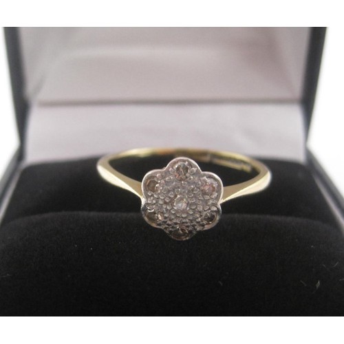 177 - 18 carat gold diamond ring, set with seven round cut diamonds in a foliate setting, ring size N, gro... 