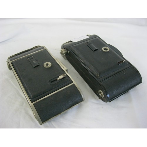 189 - A pair of antique Voigtlander bellows cameras comprising: a Bessa with Voigtar 1:7.7 F=10.5cm lens a... 