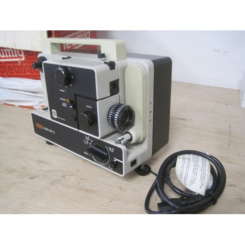 26 - A boxed Eumig Mark 607 D cine projector,  a Rollei P35E 35mm slide projector, with case and instruct... 