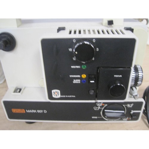 26 - A boxed Eumig Mark 607 D cine projector,  a Rollei P35E 35mm slide projector, with case and instruct... 