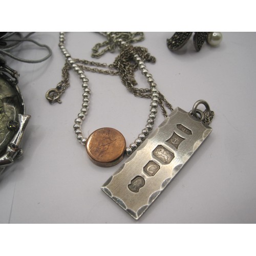 37 - A silver ingot pendant with large hallmarks for Birmingham, 1977, on 925 chain, combined 17.9g, a pa... 