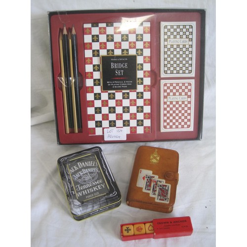 154 - Parlour games - a Marks and Spencer bridge set, a pack of Waddington playing cards in leather wallet... 