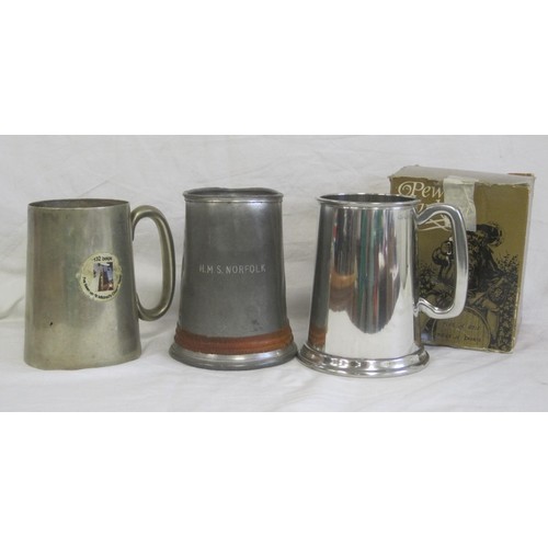 153 - A dented and a/f pewter tankard engraved HMS Norfolk, an electroplated 1 pint tankard, and a boxed S... 