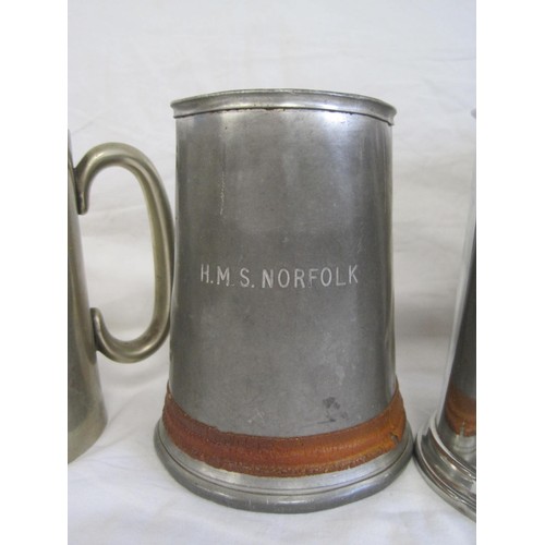 153 - A dented and a/f pewter tankard engraved HMS Norfolk, an electroplated 1 pint tankard, and a boxed S... 