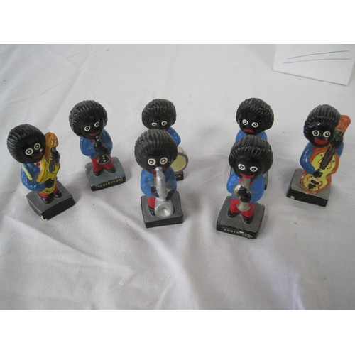 83 - A set of 7 vintage chalkware Robinson's Gollywog figures