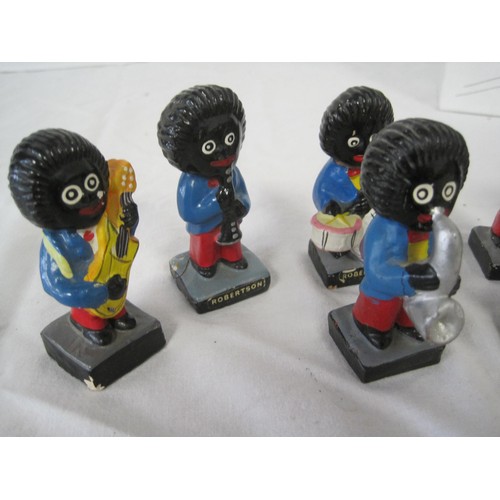 83 - A set of 7 vintage chalkware Robinson's Gollywog figures