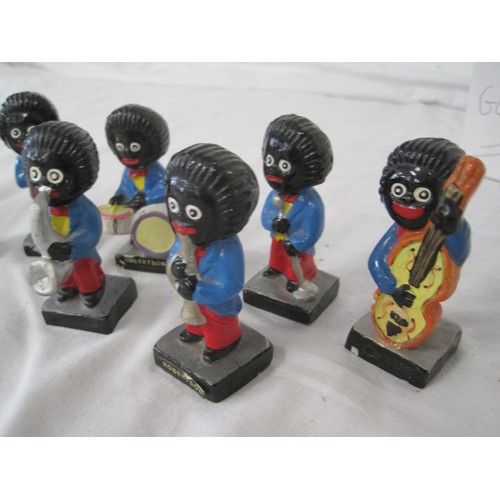 83 - A set of 7 vintage chalkware Robinson's Gollywog figures