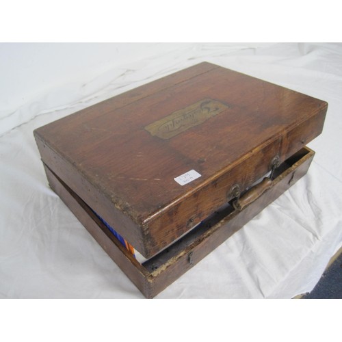 85 - A wooden box containing an assortment of interesting items including Wade figures, a Polaroid fun ca... 