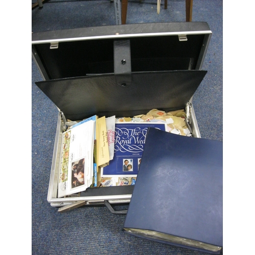 217 - A vintage attaché case containing a quantity of stamps and first day covers