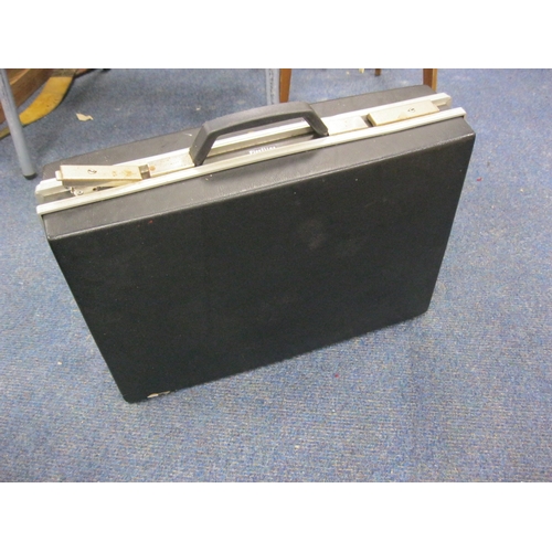 217 - A vintage attaché case containing a quantity of stamps and first day covers