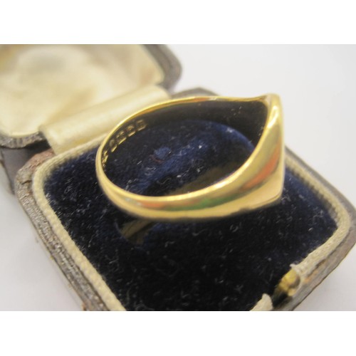 3 - An 18 carat gold gent's signet ring, oval shape with engraved interlinked initials on top. Hallmarke... 