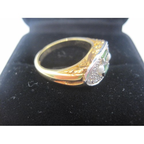 4 - A striking and distinctive fancy dress ring set with two seed pearls, two trap cut green tourmalines... 