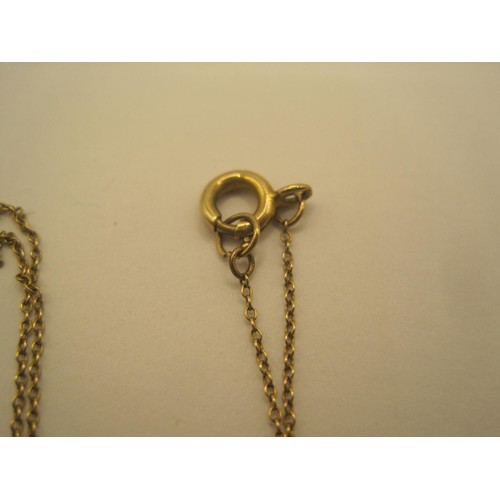 5 - A fine trace yellow metal chain with engraved cross pendant. The pendant hallmarked 9ct gold, Cheste... 