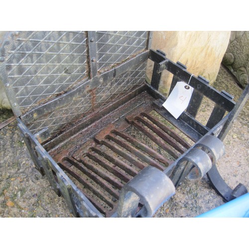 24 - A heavy cast iron fire basket