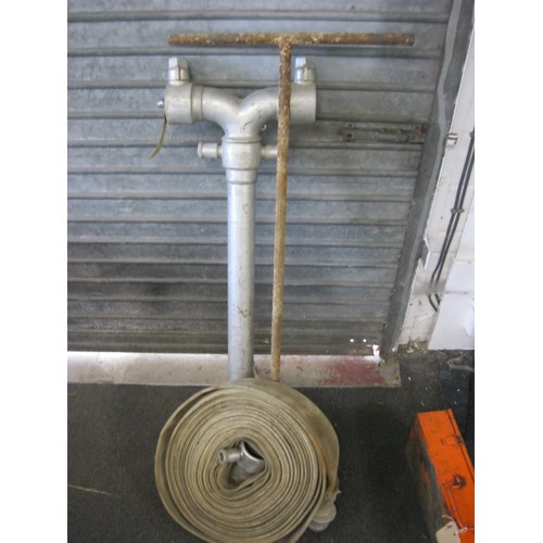 64 - A stand pipe, fire hose and valve key