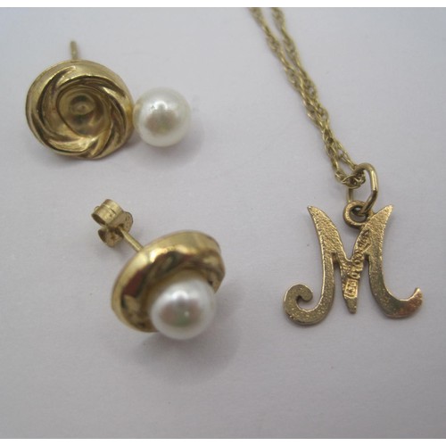 33 - A gold initial pendant 'M' on gold chain, stamped 375 9CT, approx. 1.1g. A pair of earrings stamped ... 