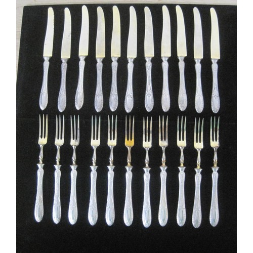 142 - 22 French silver handled knives and forks 11pairs total weight 847 grams including the blades and an... 