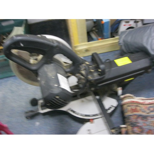 54 - A Wickes brand radial arm 2kW mitre saw with spare blade in good cosmetic condition