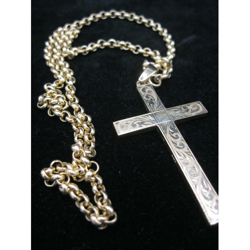 30 - A 9 carat gold crucifix with engraved foliate decoration to front on a 9 carat gold chain, crucifix ... 