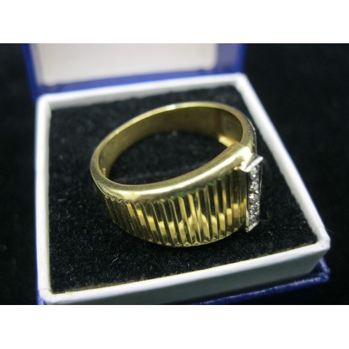 32 - A gentleman's dress ring in 18 carat gold set with a ridge containing 5 small diamonds, ring size Q/... 