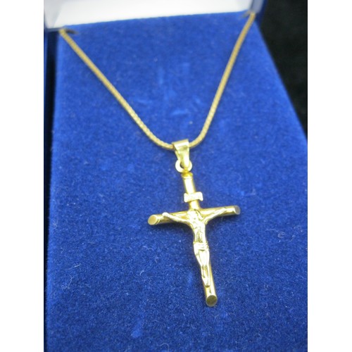 56 - A 9 carat gold crucifix with figural Christ mounted on a fine 9 carat gold box link chain, chain len... 