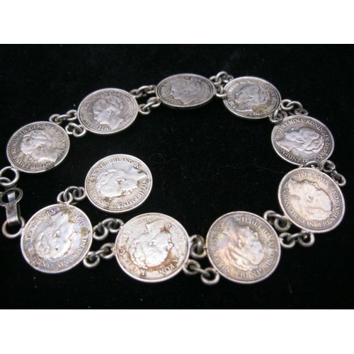 61 - An antique coin bracelet comprising 10 1930s Dutch 10 cent coins featuring Queen Wilhemina, approx w... 