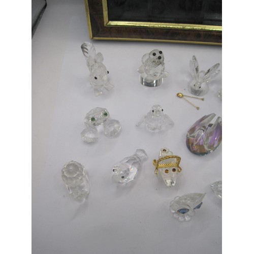 29 - Seventeen Swarovski crystal animals - squirrel, bird, frog, hedgehog, etc, with a display cabinet me... 