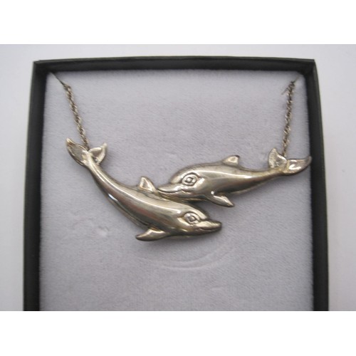 64 - A boxed sterling silver necklace featuring two dolphins and a sterling silver chain, approx weight 1... 