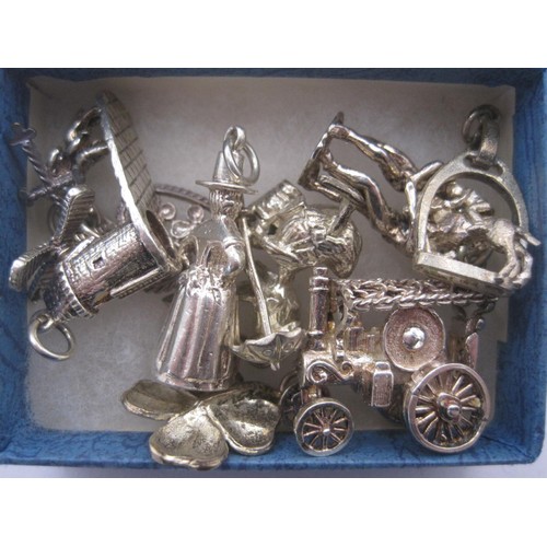 66 - 8 sterling silver charms including traction engine, Welsh lady, clover etc approx weight 36g