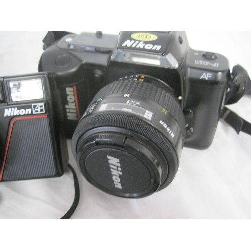 73 - A Nikon AF F-401 35mm SLR camera with Nikon AF Nikkor 35-70mm lens, in excellent cosmetic condition ... 