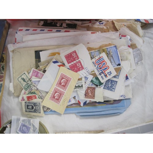 46 - An assortment of Great Britain and world stamps contained in four small albums and a basket of loose... 