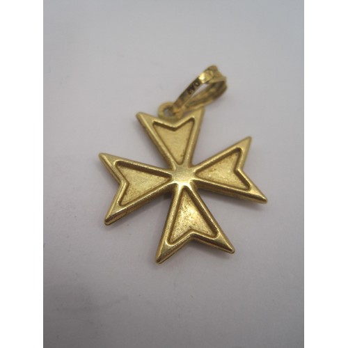 115 - A small Maltese cross pendant marked for 18 carat gold and acid tests as such, set with possibly jet... 