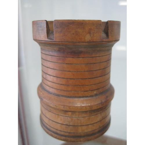 3 - An antique boxwood dice shaker in the form of a castle turret, height 72mm, diameter of base 53mm