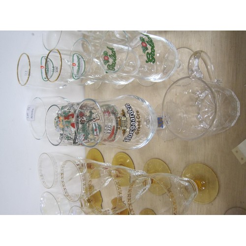 52 - Assorted beer glasses (Grolsch, Hoegaarden, etc) and other glass drinking vessels including brown gl... 