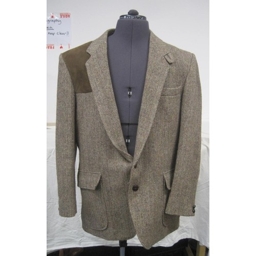 74 - A 100% Harris Tweed shooting jacket marked as size 42L in apparently unworn condition, no tags, plus... 